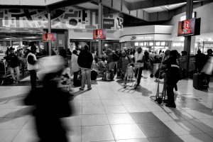 Digital Screens in a busy train station concourse